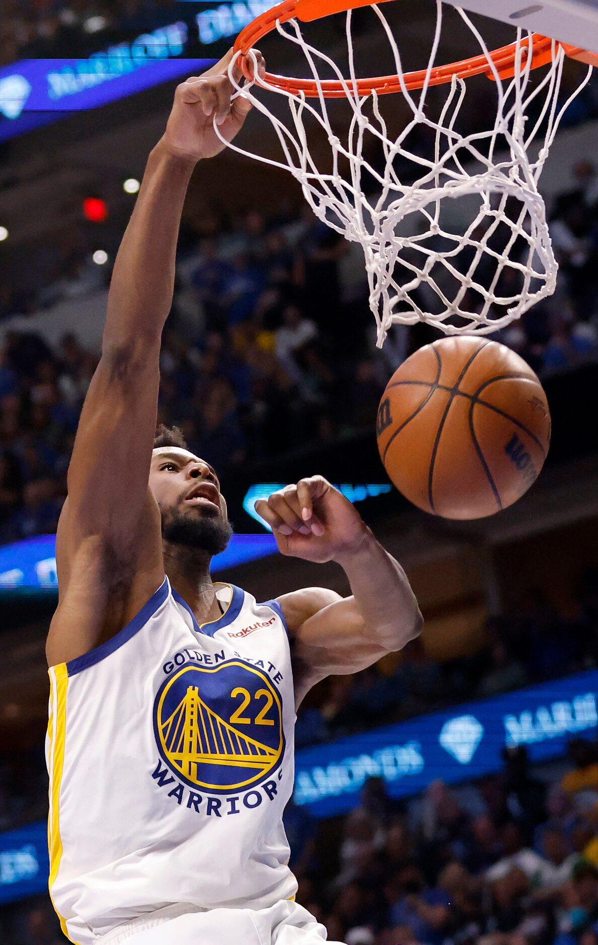 Golden State Warriors forward Andrew Wiggins (22) dunks the ball on the Dallas Mavericks...