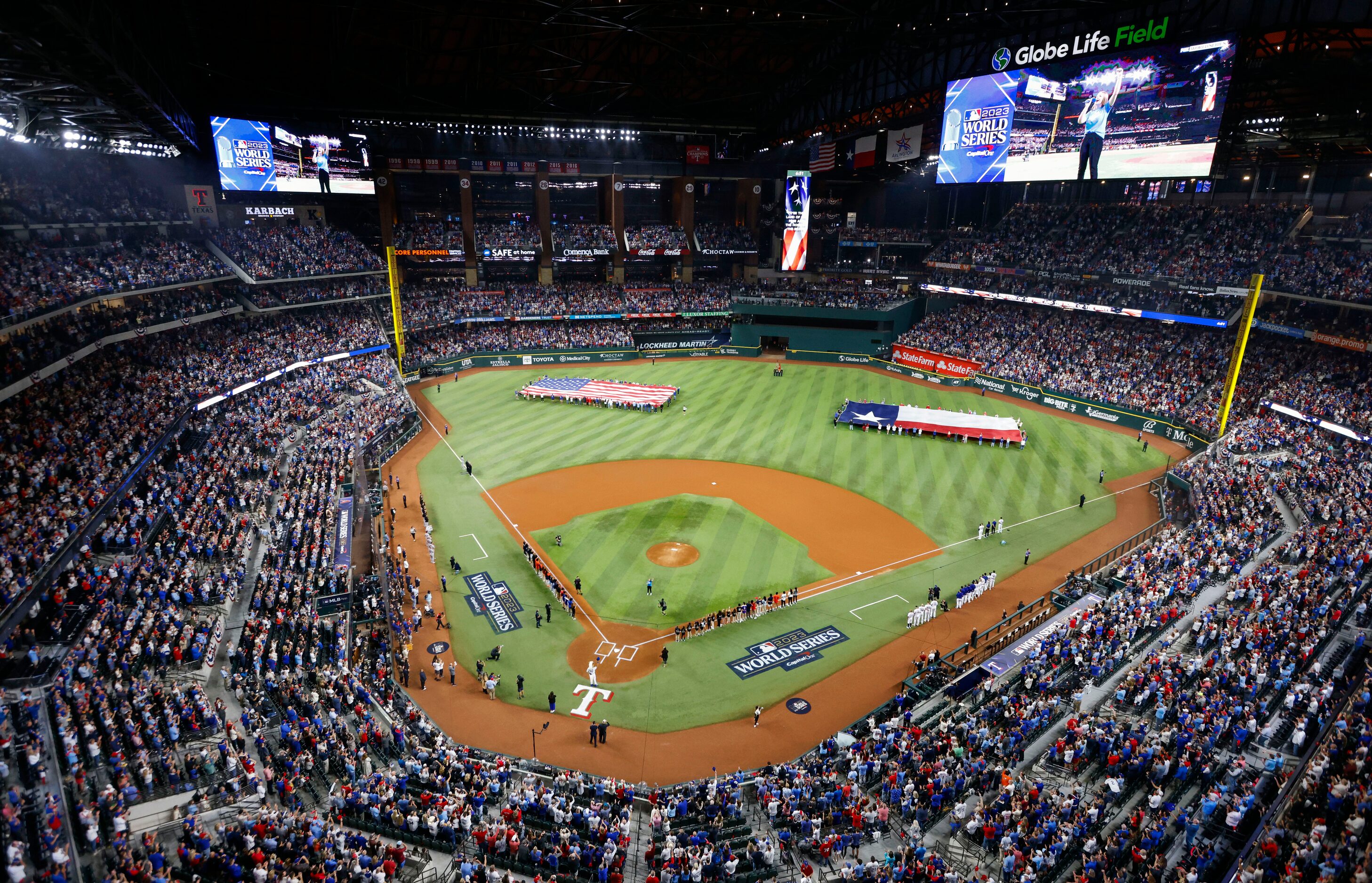 Fans and players stand for the National Anthem sung by Pearl Peterson ahead of Game 2 of the...