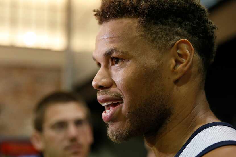 Dallas Mavericks second-year guard/forward Justin Anderson talks with the media after...