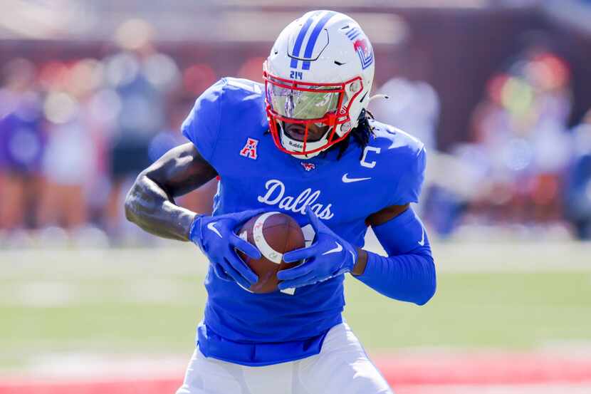 SMU wide receiver Rashee Rice looks to run after catching a pass during the first half of an...