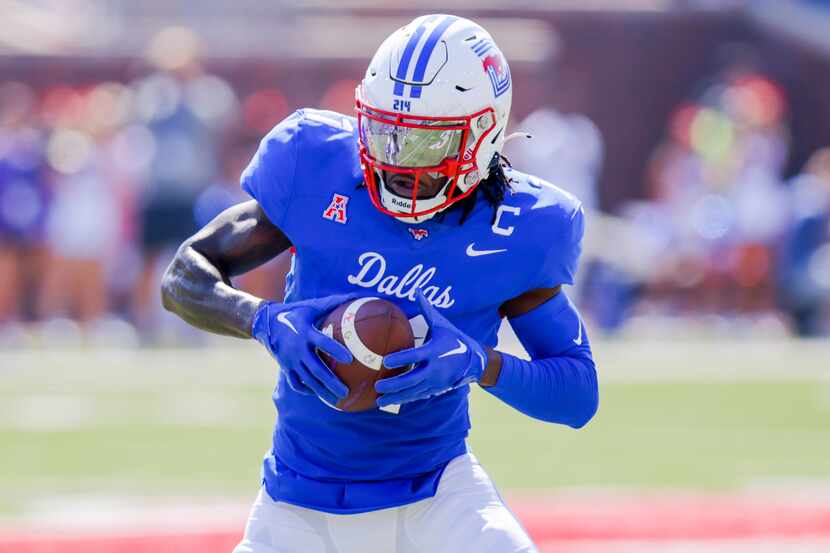 SMU wide receiver Rashee Rice looks to run after catching a pass during the first half of an...