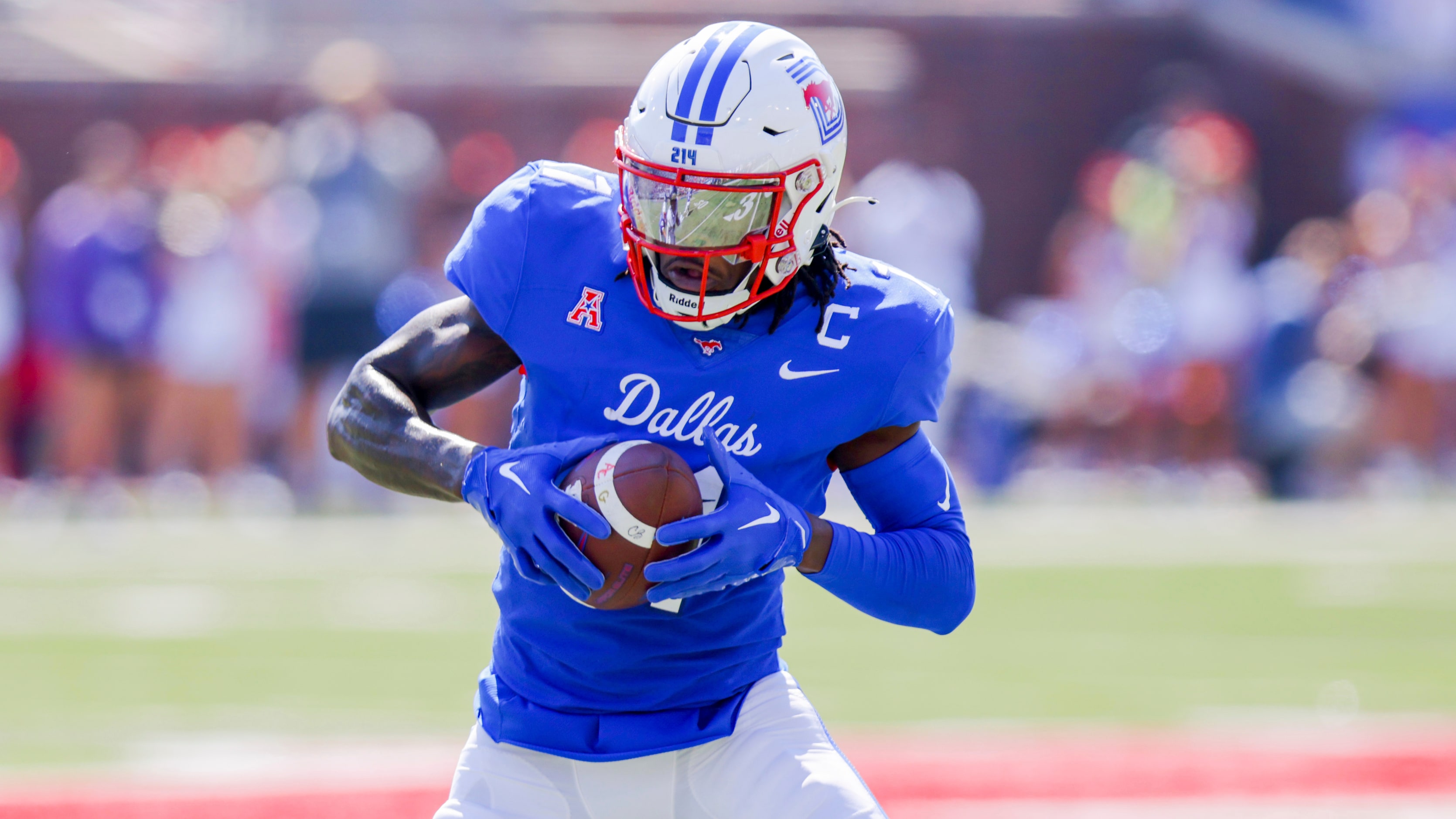 SMU wide receiver Rashee Rice looks to run after catching a pass during the first half of an...