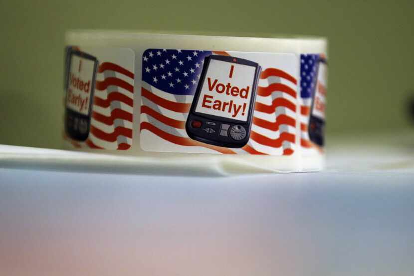 In this 2014 file photo, "I Voted Early" stickers are seen at an early voting polling site...