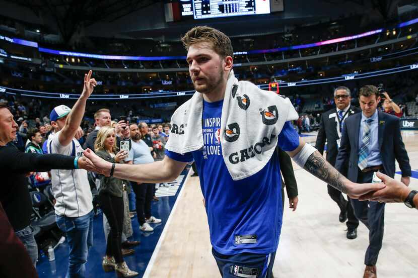 Dallas Mavericks guard Luka Doncic (77) exits the court following a win over the Sacramento...