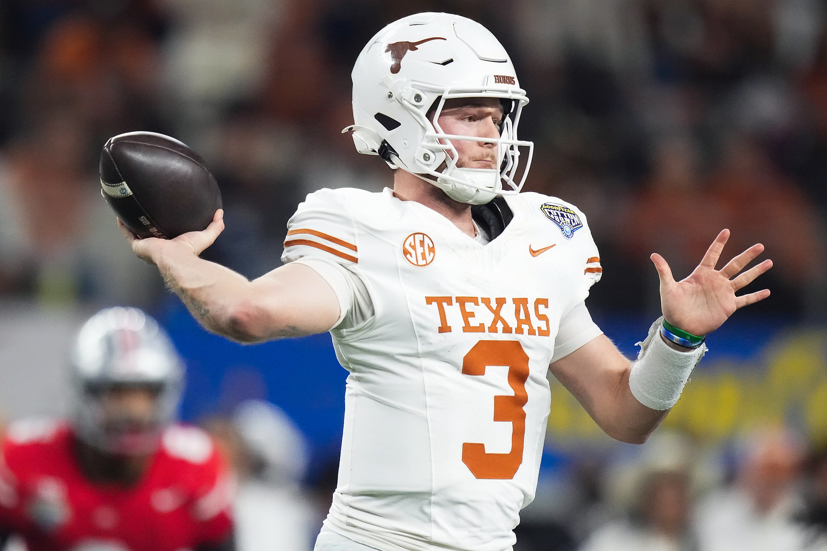 Texas quarterback Quinn Ewers (3) throws a pass during the first half of the Cotton Bowl...