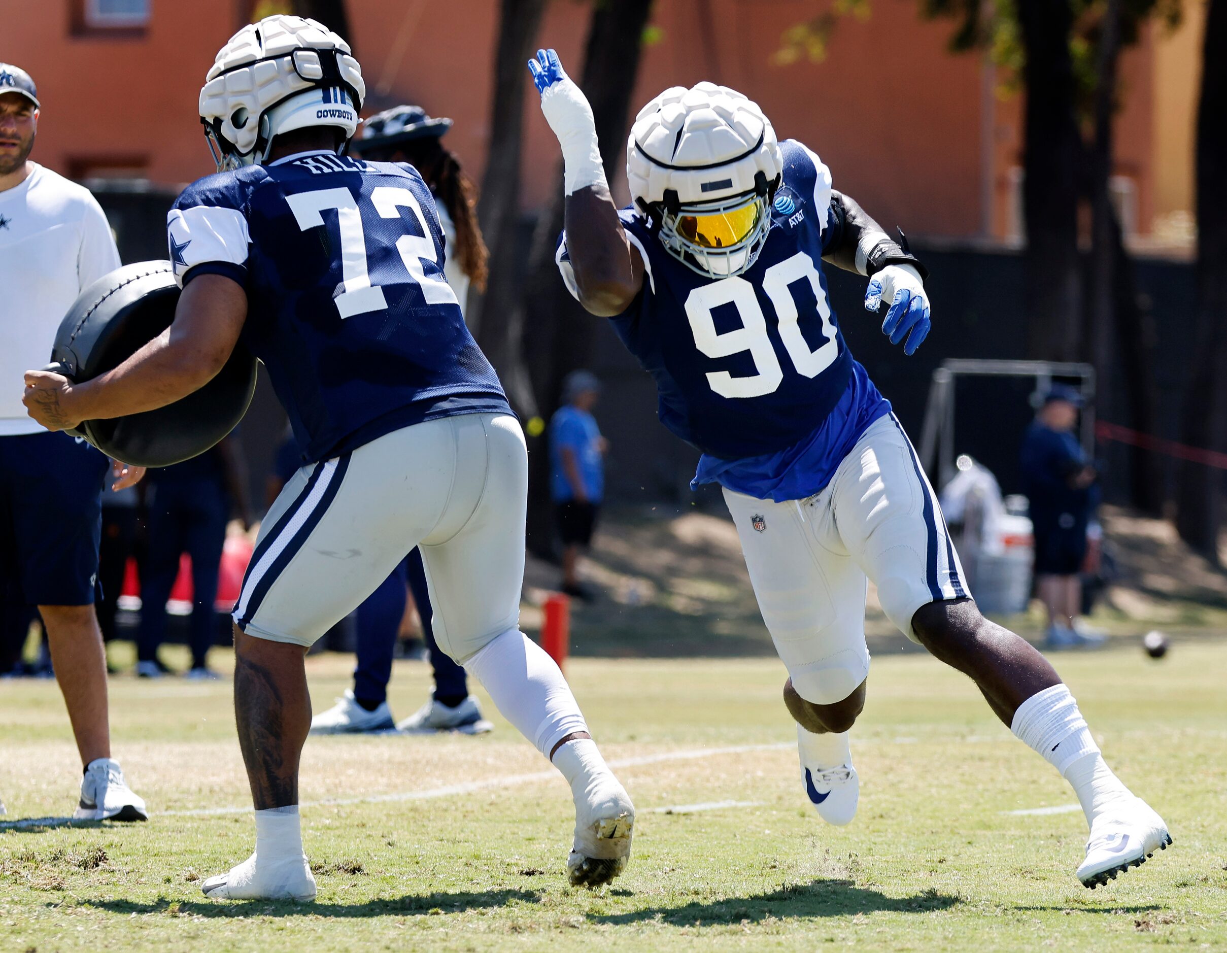 Dallas Cowboys defensive end Demarcus Lawrence (90) runs a pass rush drill past defensive...