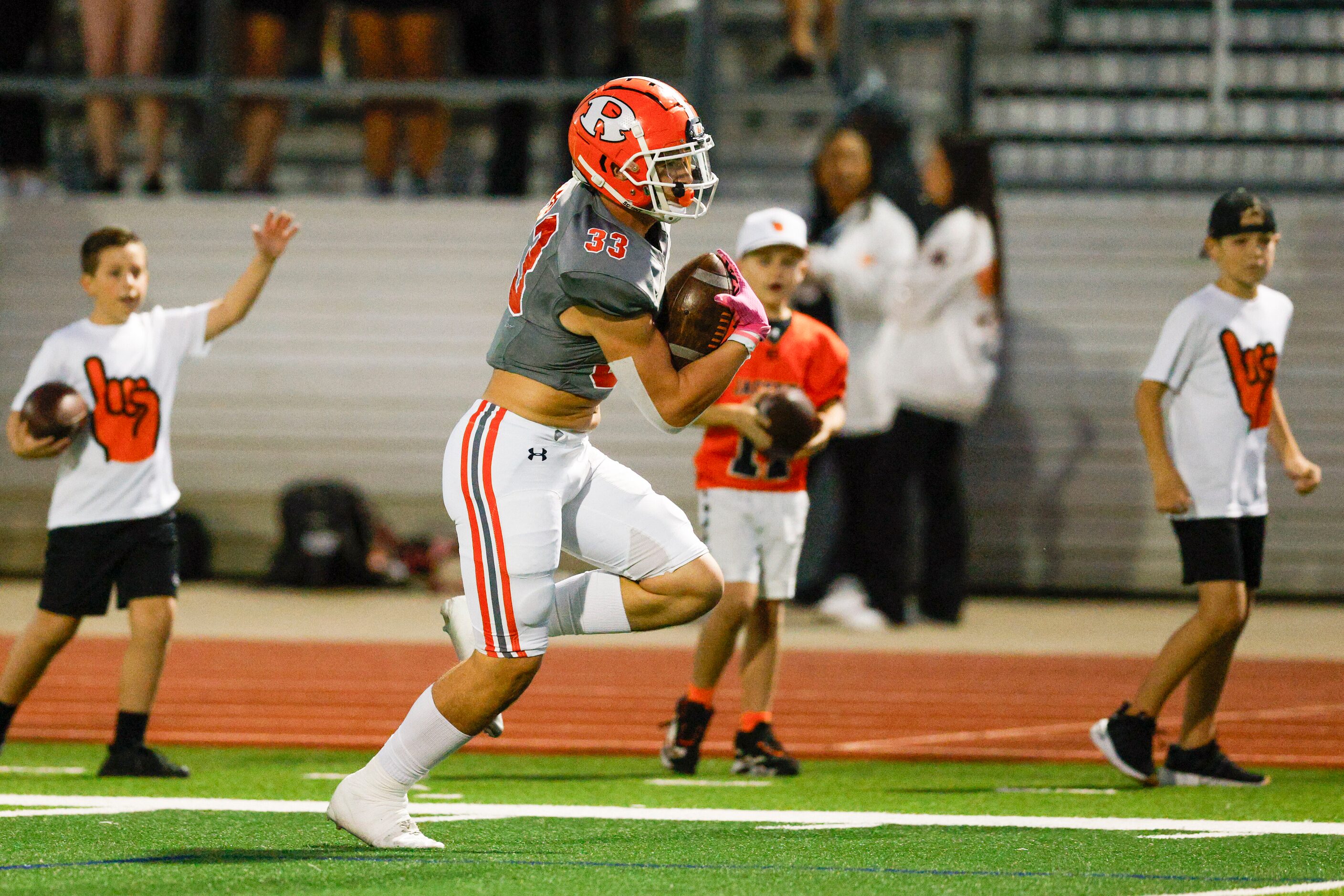 Rockwall tight end Jackson Stoner (33) runs for a touchdown after a catch during the first...