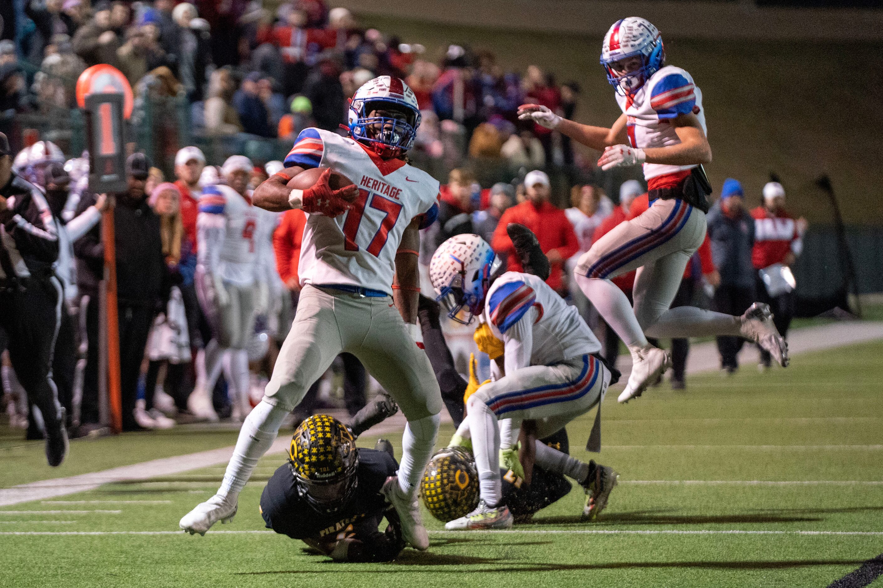 Midlothian Heritage senior running back Mason O’Neal (17) pulls away from the Crandall...