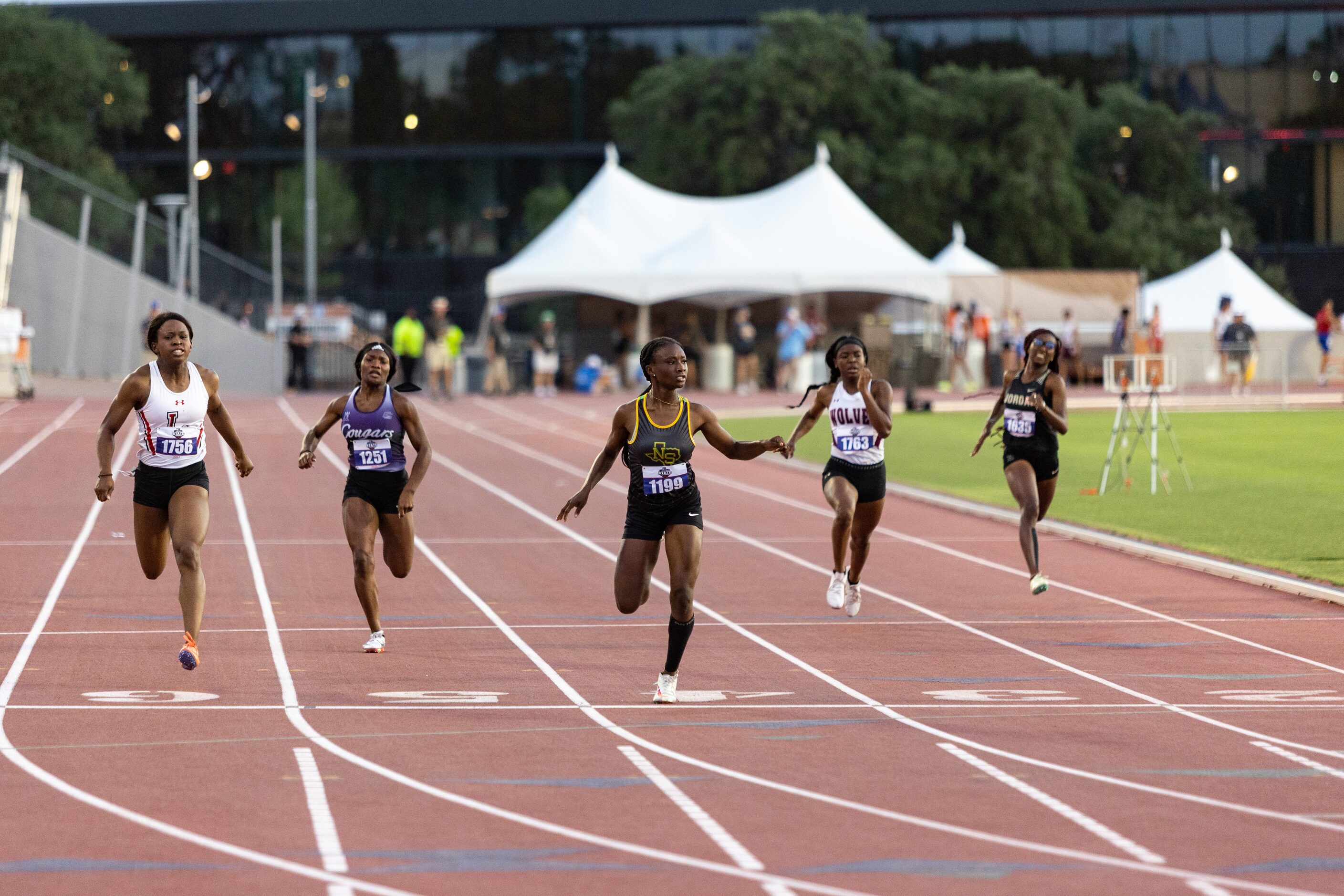 Aniyah Bigam of Carrollton Smith looks to the scoreboard for her time as she competes in the...