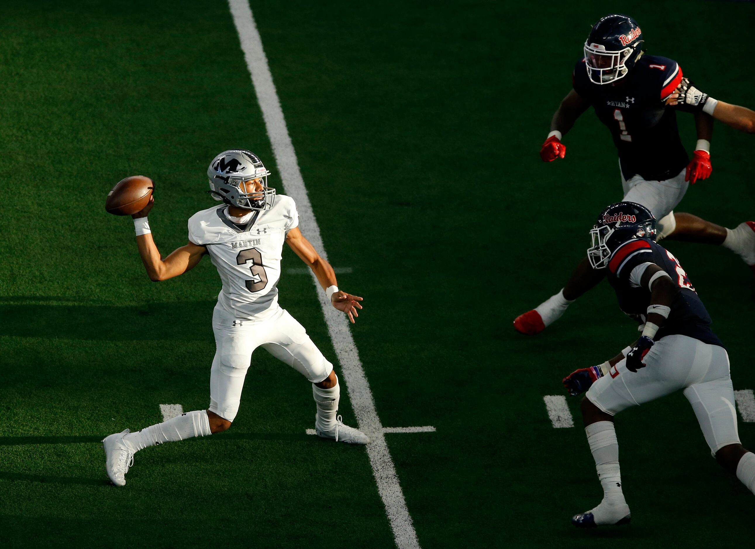 Arlington Martin quarterback Cydd Ford (3) throws a pass as he rushed by Denton Ryan's...