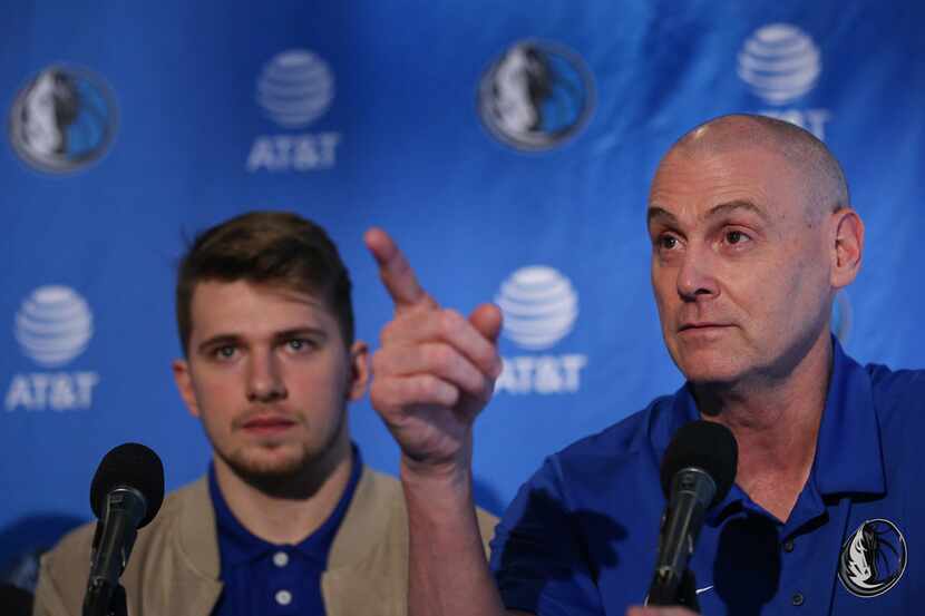 Mavericks head coach Rick Carlisle speaks while introducing draft picks Luka Doncic (left)...