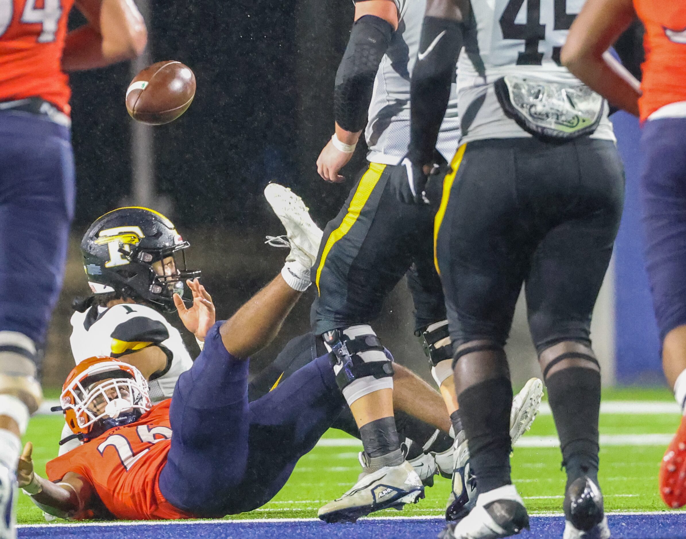 McKinney North running back Jayden Walker (26) looks up as the ball flies from his hands...