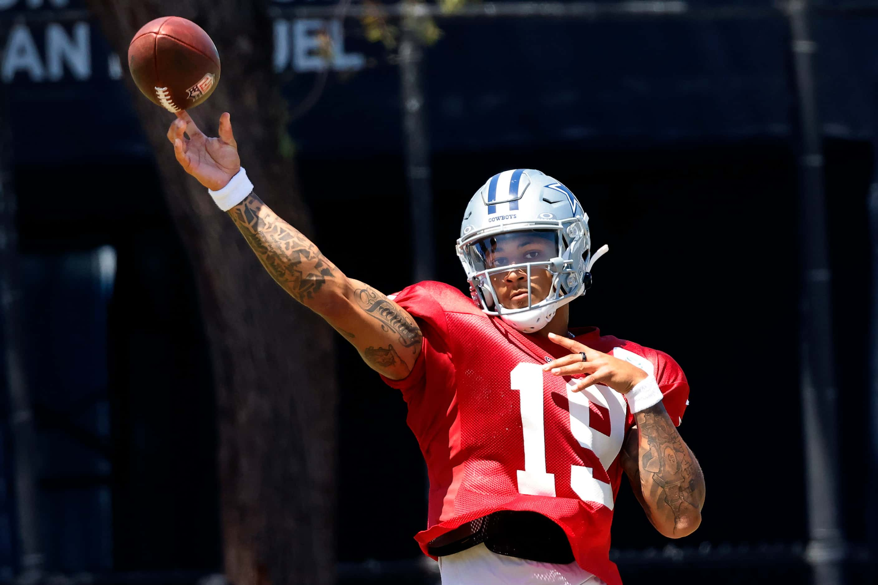 Dallas Cowboys quarterback Trey Lance (19) throws a deep pass during training camp practice...