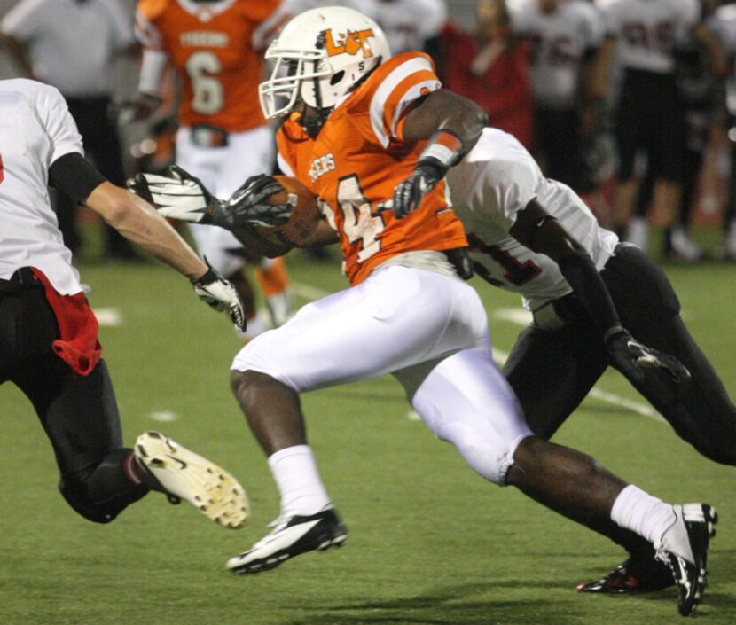 Lancaster senior running back Joseph Paden (24) carries the ball against Mansfield Legacy...