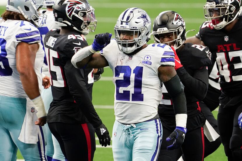 Dallas Cowboys running back Ezekiel Elliott celebrates after picking up a first down during...