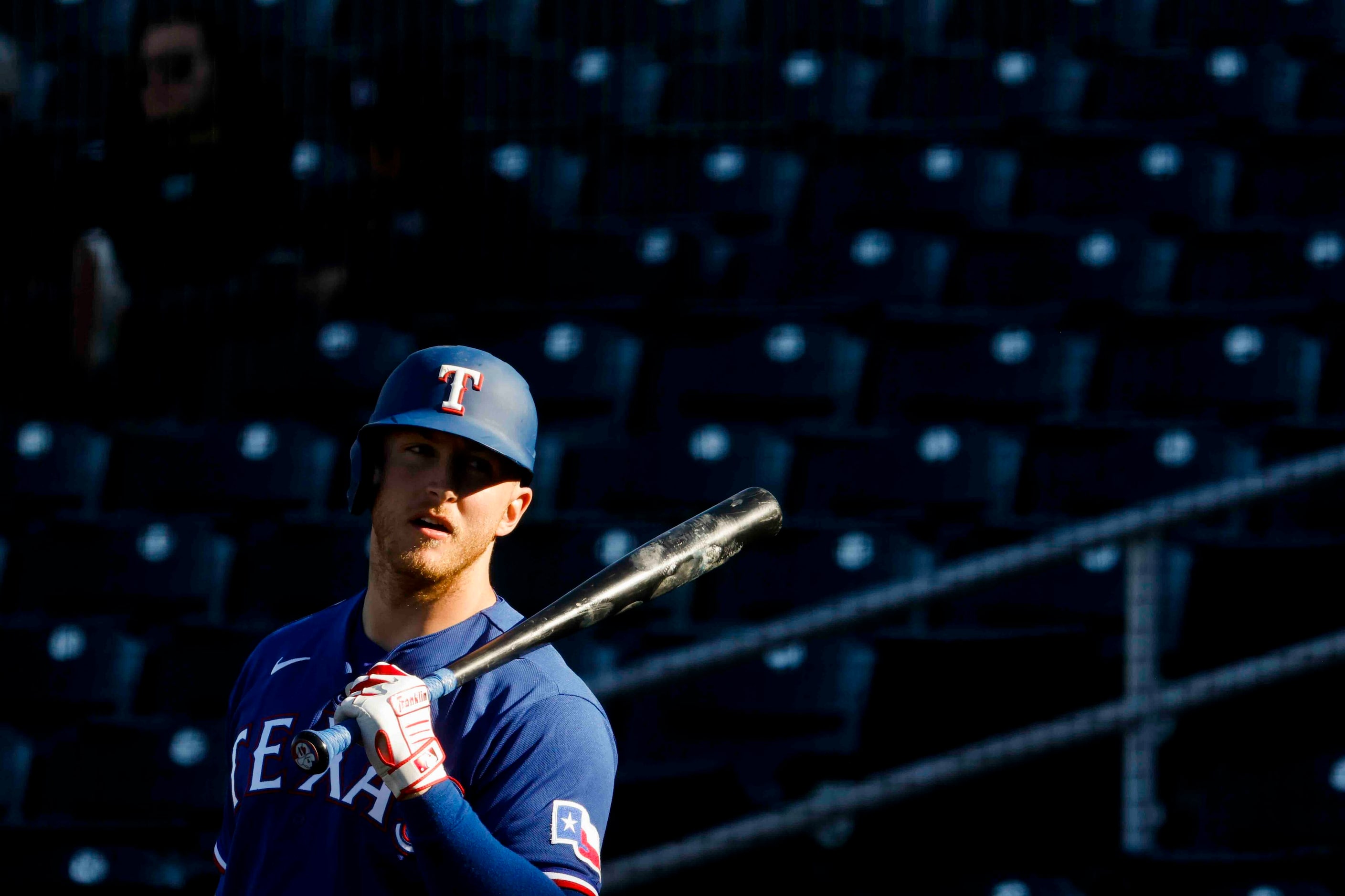 Texas Rangers outfielder Joe McCarthy waits to bat during the ninth inning of a spring...