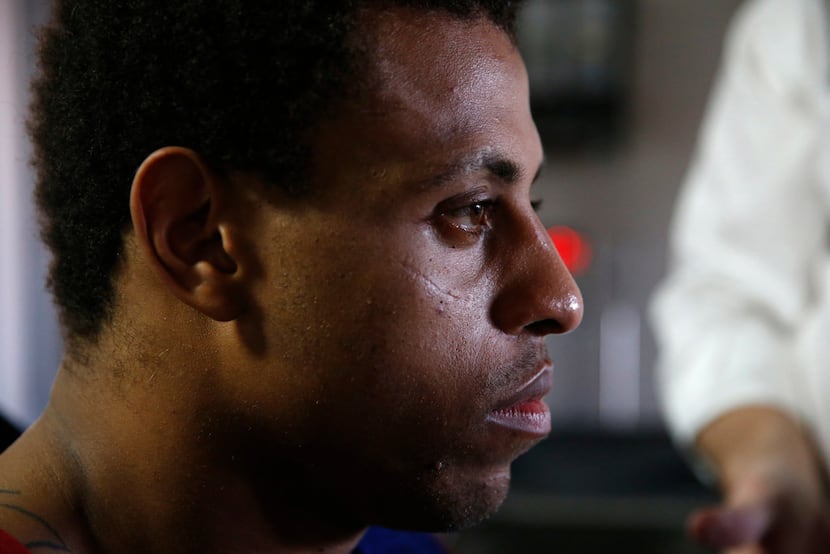 Greg Hardy waits to step on the scales on Feb. 15 at Deep Ellum Distillery in Dallas to see...