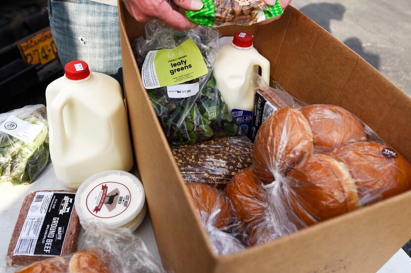 A farm box food order from Profound Foods, at a pickup location outside Community Beer Co....