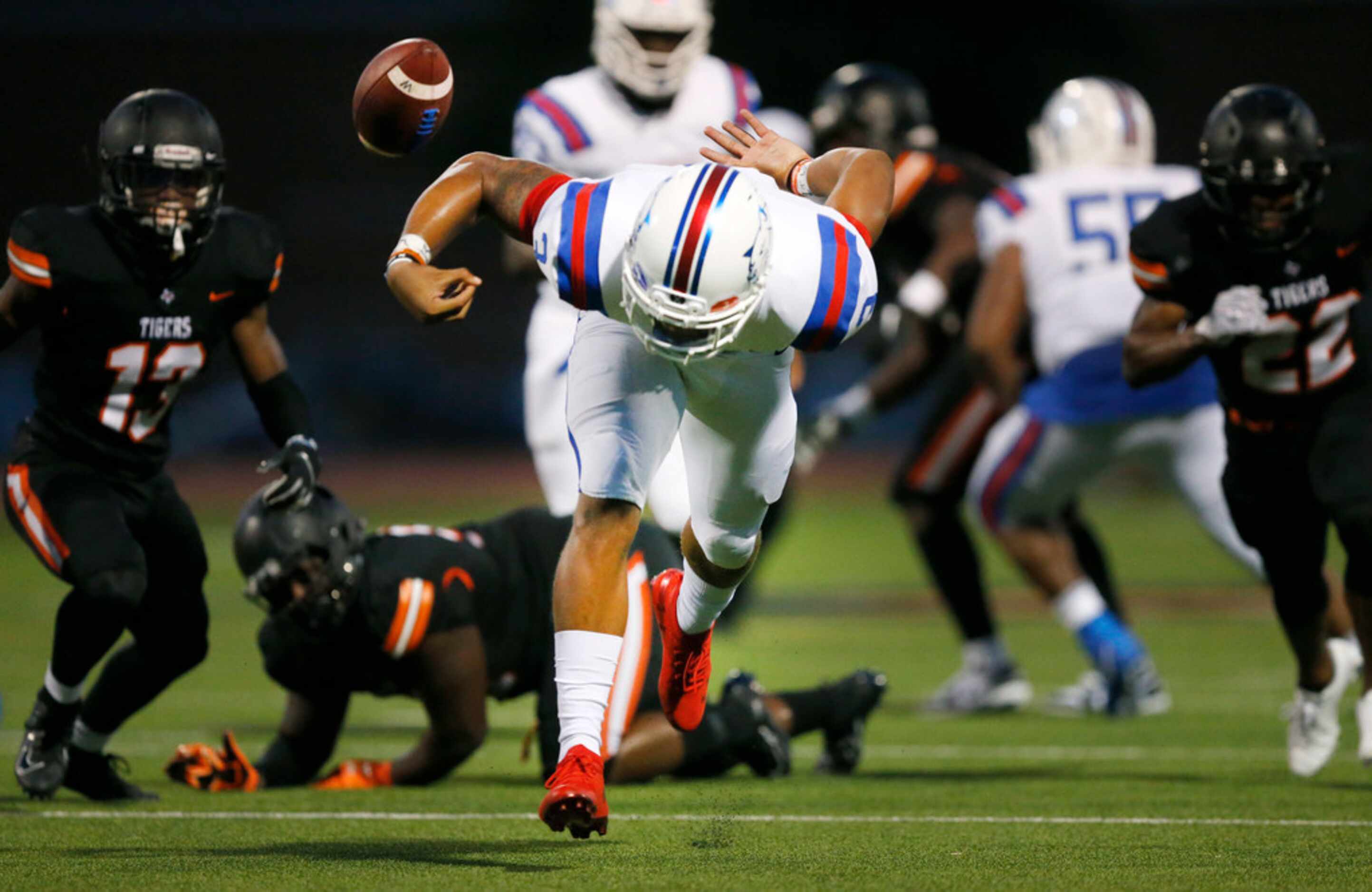 Duncanville quarterback Ja'Quinden Jackson (3) looses the grip on the ball turning it over...