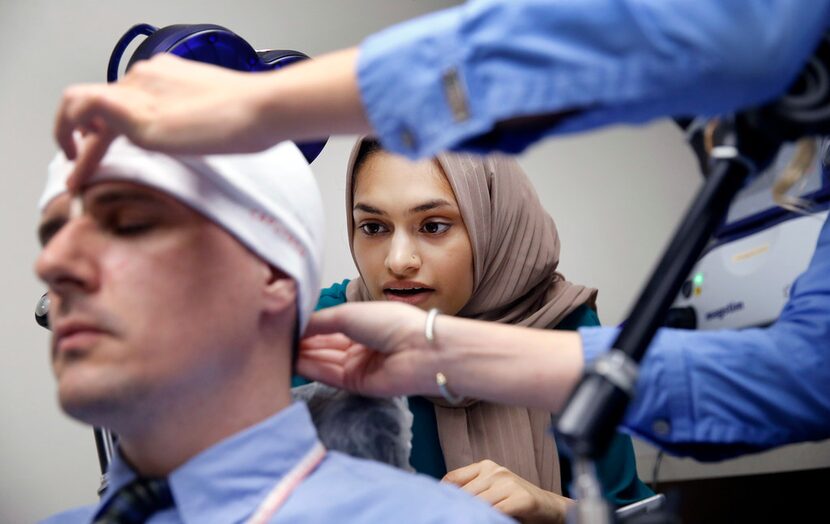 Research assistant Khadija Saifullah looks at a measurement made while practicing the use of...