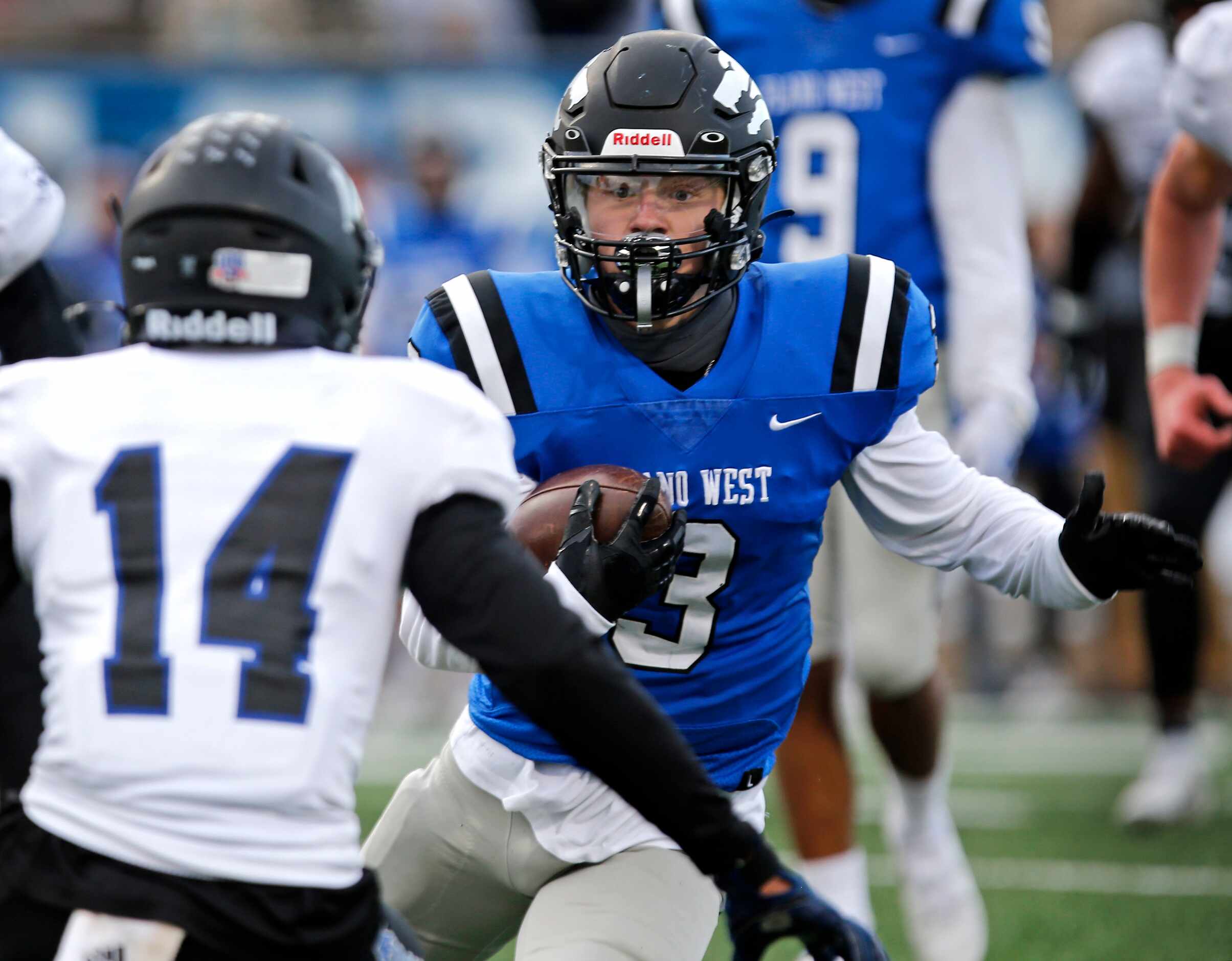 Plano West High School quarterback Charlie Johnson (3) tries to avoid Hebron High School...