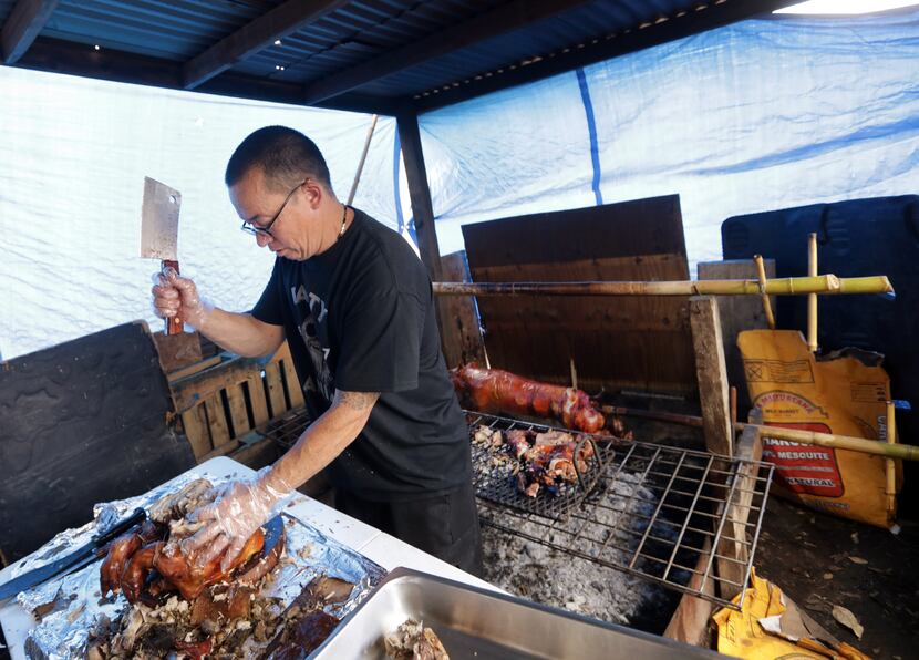 Allen Cook prepares some food at Old Rooster Creek Filipino Asian/American BBQ in Princeton.