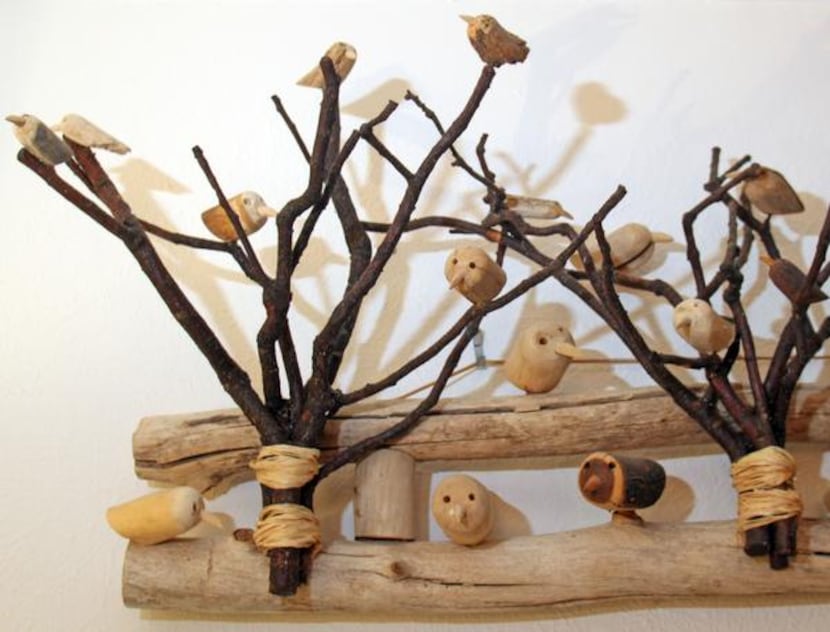 
Tiny carved birds on twigs is a piece of folk art found in a Santa Fe gallery. 
