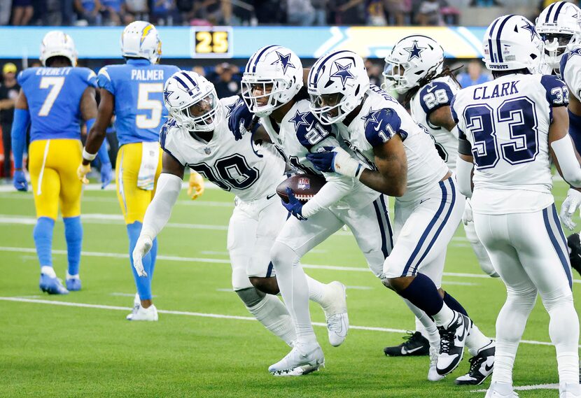 Dallas Cowboys cornerback Stephon Gilmore (21) was congratulated by teammates Micah Parsons...