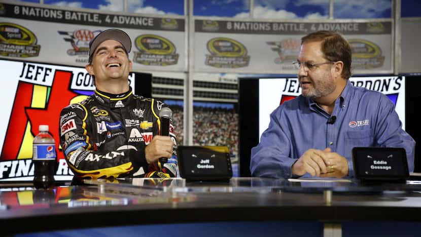 Four-time NASCAR Sprint Cup Series champion Jeff Gordon (left) reacts to Texas Motor...