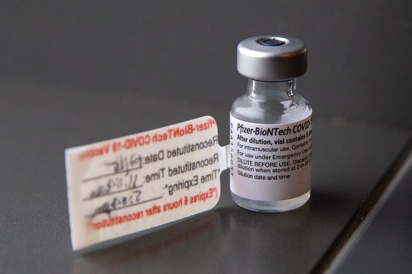 A vial containing five doses of the Pfizer COVID-19 vaccination during a media event at...