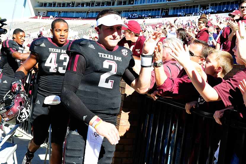 STARKVILLE, MS - NOVEMBER 03:  Johnny Manziel #2 of the Texas A&M Aggies greets fans...