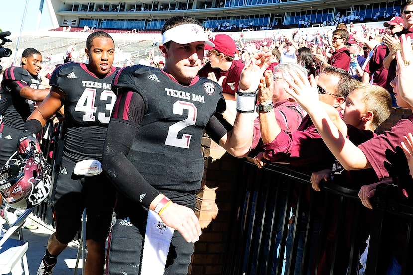 STARKVILLE, MS - NOVEMBER 03:  Johnny Manziel #2 of the Texas A&M Aggies greets fans...