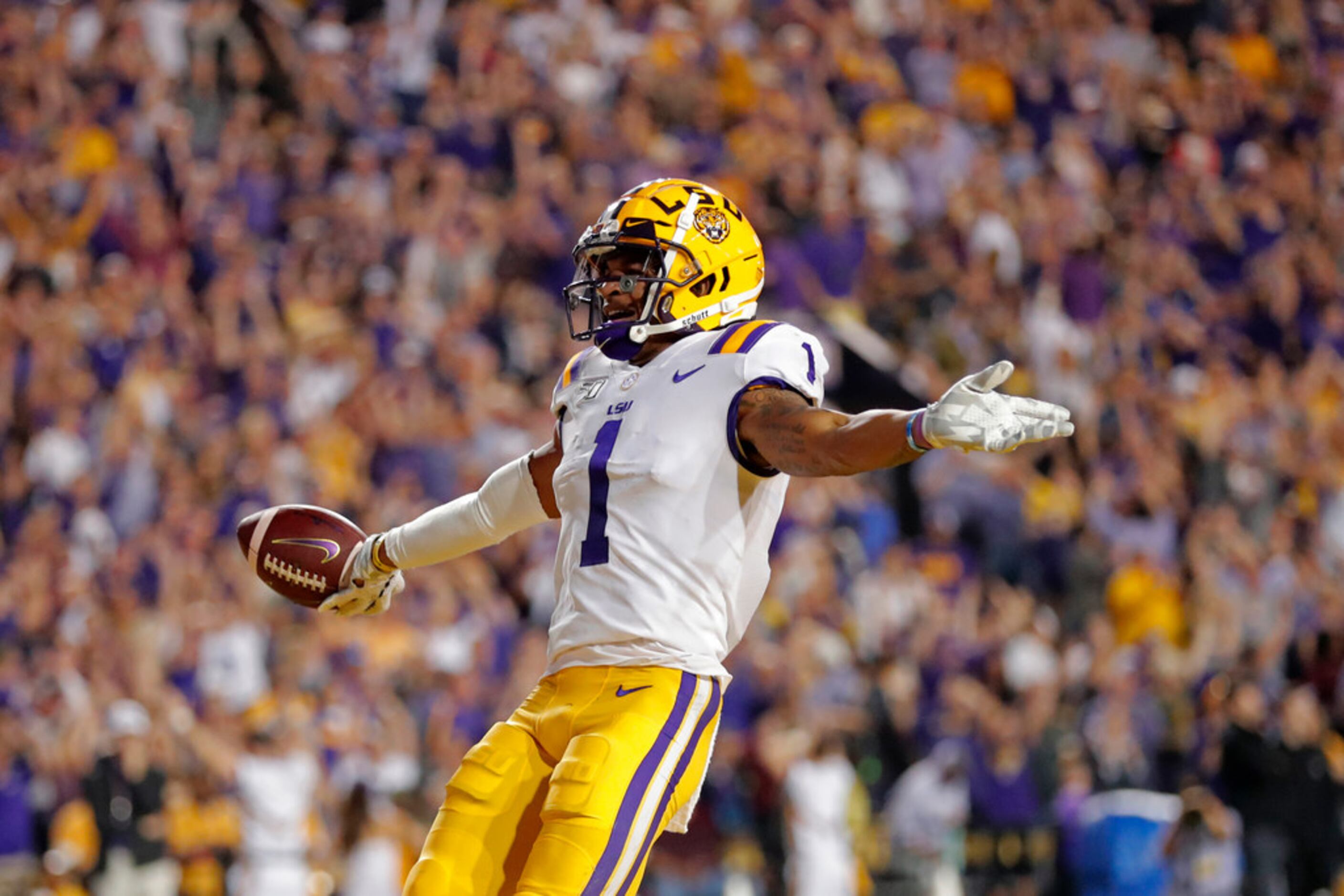 LSU wide receiver Ja'Marr Chase (1) celebrates his touchdown reception during the first half...