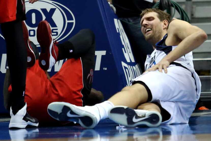 Dallas Mavericks power forward Dirk Nowitzki (41) reacts after being fouled during the first...