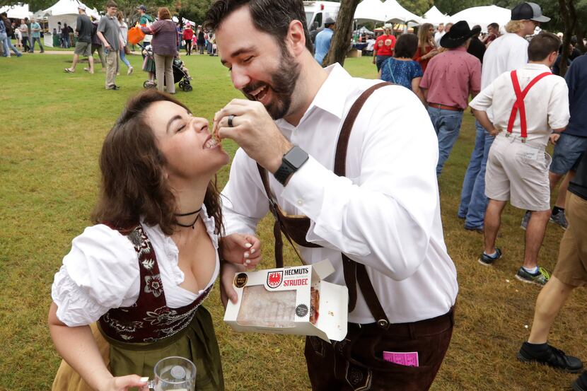 Taly Reinhart, left, and Brian Reinhart enjoy some strudel during the Addison Octoberfest in...
