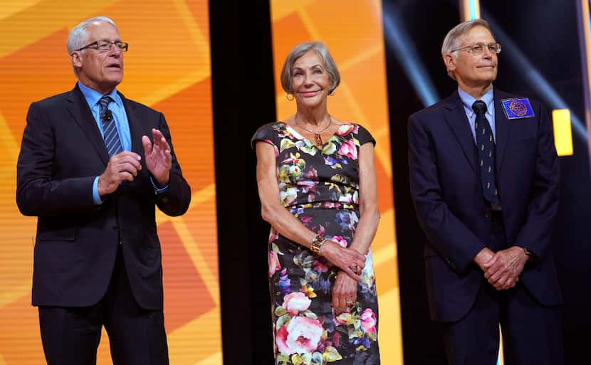 Alice Walton (center) shares the stage at Walmart's annual meeting in June with brothers Rob...