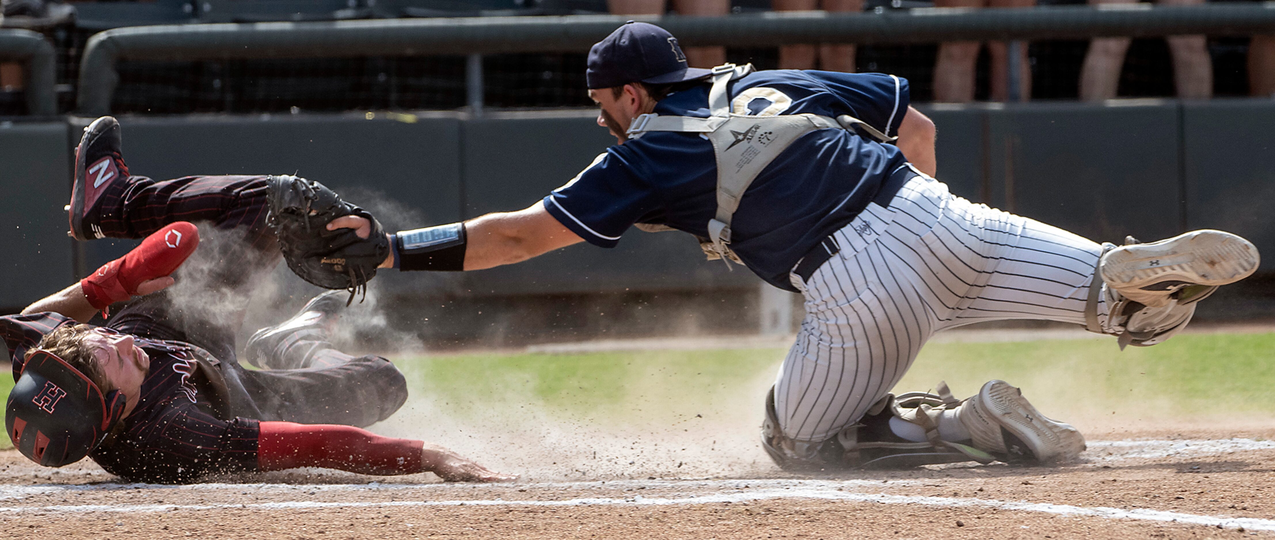 Rockwall-Heath Karson Krowka, (5), slides under the tag by Keller Colin Liles, (12), during...