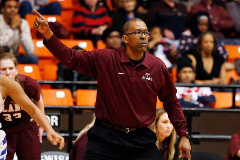 Plano's Rodney Belcher coaches his team against Duncanville in the regional championship...