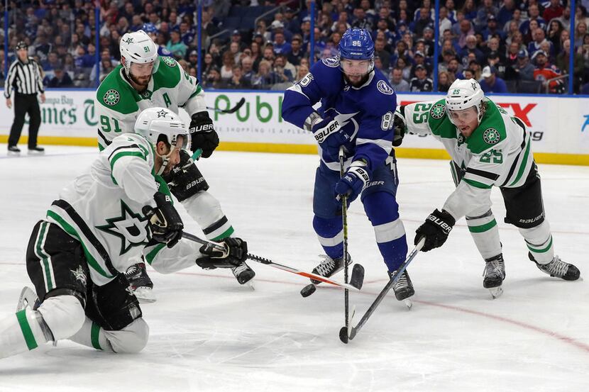 Tampa Bay Lightning's Nikita Kucherov, of Russia, breaks through the defense of Dallas...