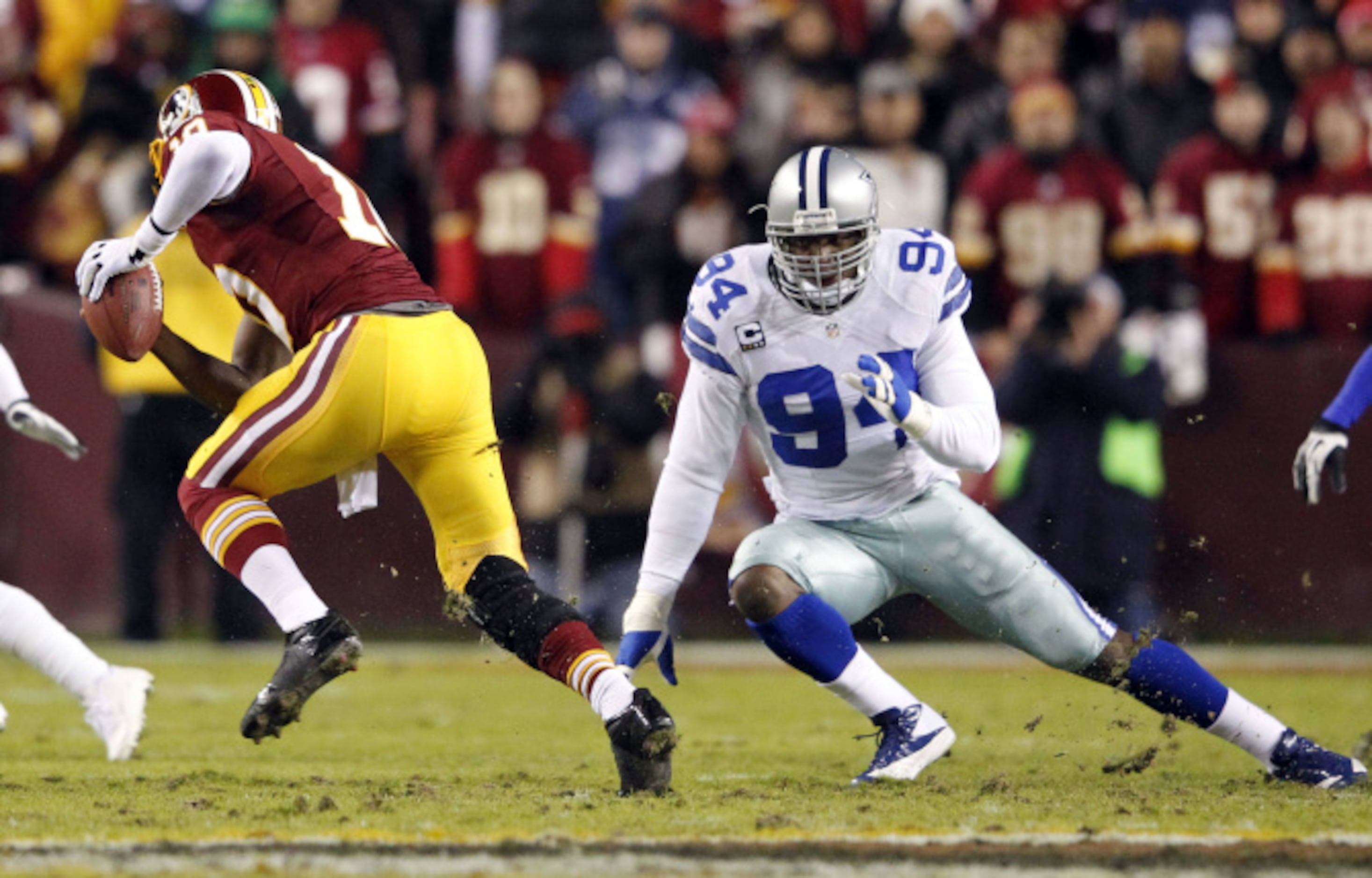 Darren Woodson of the Dallas Cowboys walking on the field during a