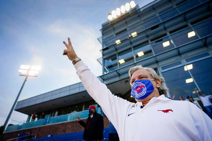 SMU fan Paul Layne stands for the playing of the school’s alma mater before a game against...