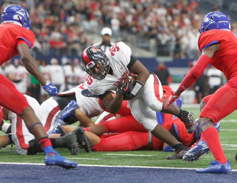 Euless Trinity running back Jaylin Buffin (35) dives into the end zone for a second quarter...