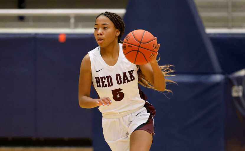 Red Oak’s Breanna Davis (5) dribbles the ball against Wylie East during the Class 5A Region...
