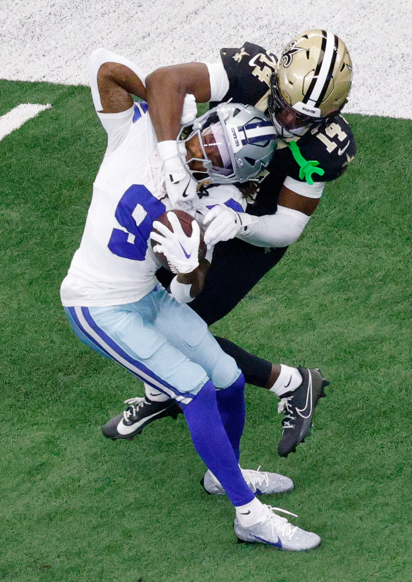 Dallas Cowboys wide receiver KaVontae Turpin (9) is tackled by New Orleans Saints cornerback...