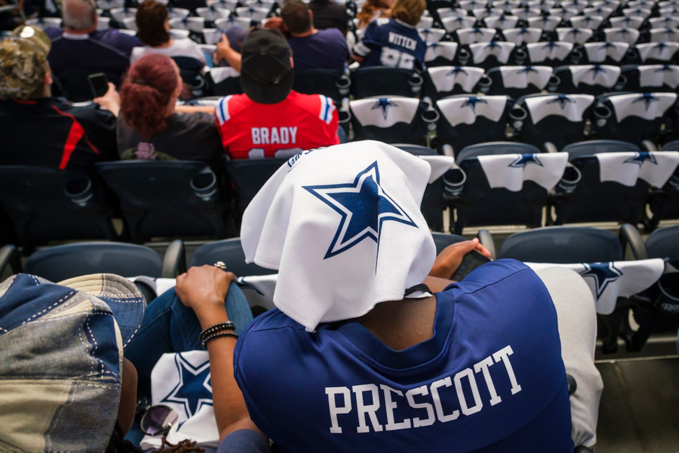 Fans take their seats before an NFL football game between the Dallas Cowboys and the New...