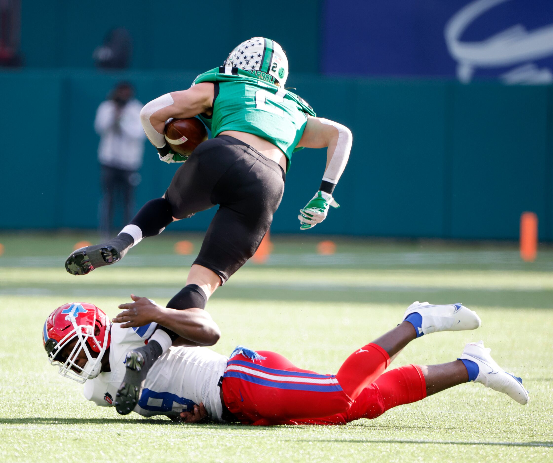 Duncanville’s Kendrick Blackshire (9) tackles Southlake wide receiver Corban Duwe (5) during...