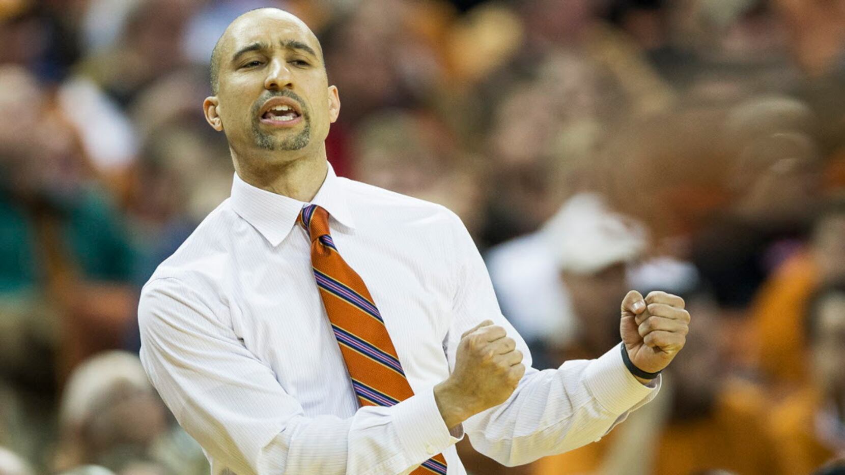 Texas head coach Shaka Smart shouts to his players during action against Texas Tech at the...