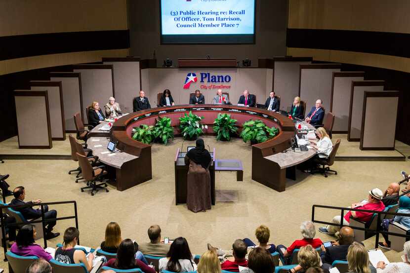 Plano resident Zeba Siddiqui, center, speaks against Plano City Council member Tom Harrison,...