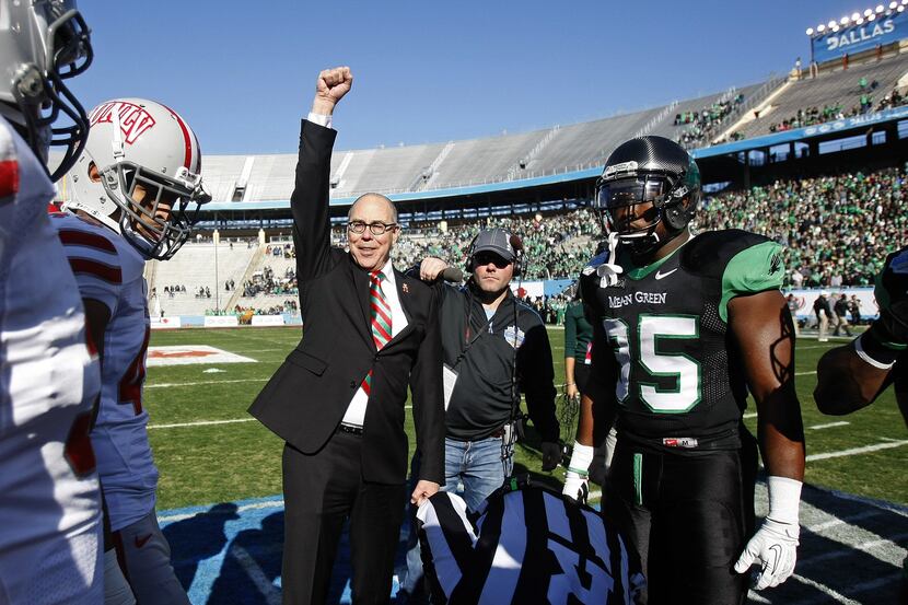 UNLV president Neal Smatresk reacts after the ceremonial coin toss as the Rebels take on...