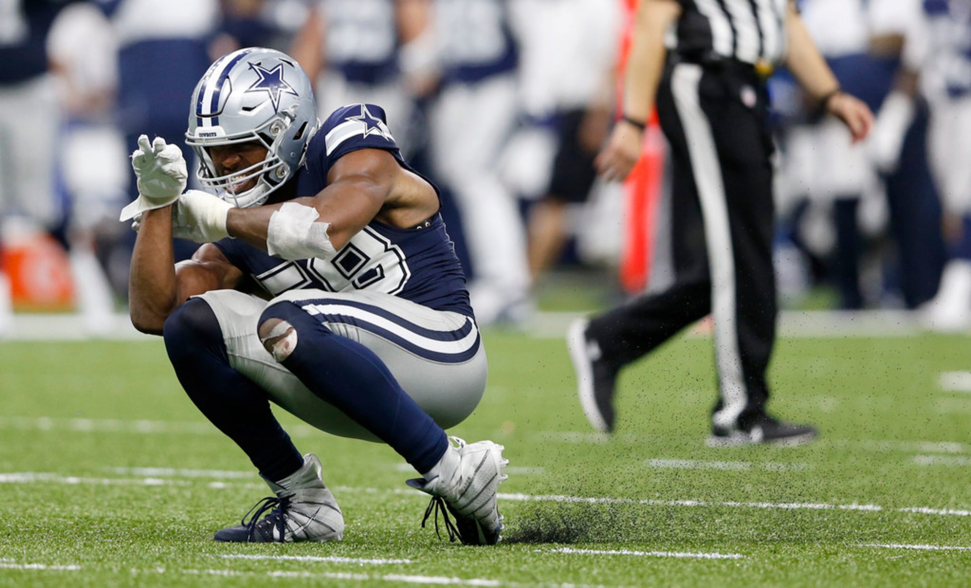 Dallas Cowboys defensive end Robert Quinn (58) celebrates after sacking New Orleans Saints...